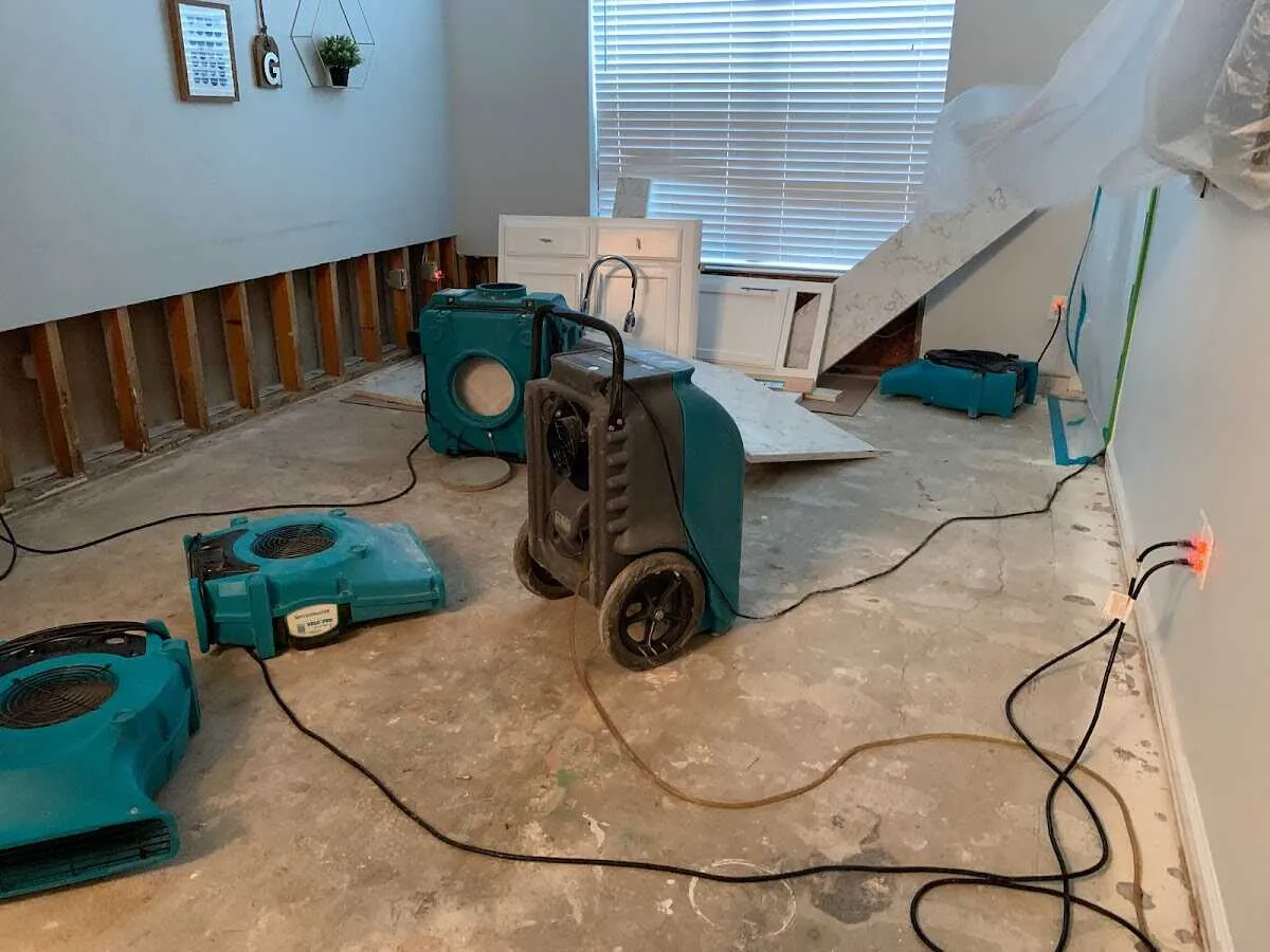 Dehumidifier in flood-cut room for Water Damage Restoration in Romeoville